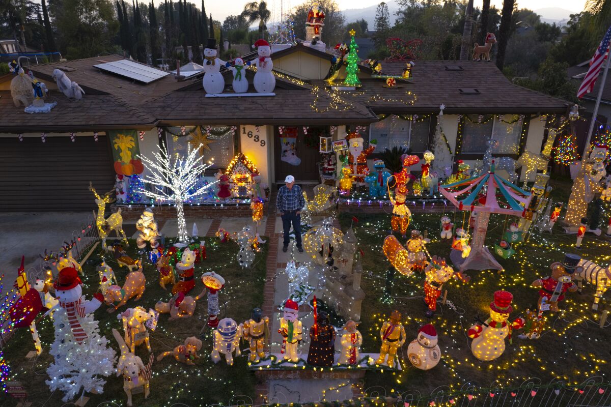 Bill Gilfillen stands amid the holiday decorations at his home in San Marcos in 2021. 