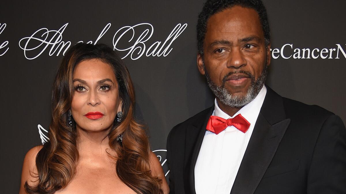 Tina Knowles and Richard Lawson looked very serious at a charity event in October, but were all smiles in a picture Beyonce posted of the newlyweds taken Sunday on a yacht off Newport Beach.