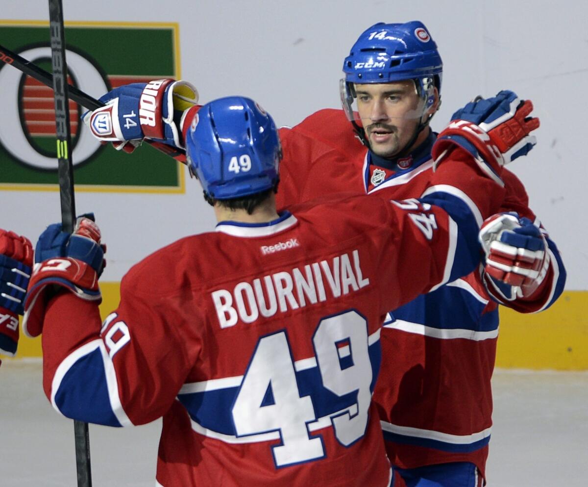 Montreal Canadiens center Tomas Plekanec, right, celebrates with teammate Michael Bournival after scoring a goal against the Ducks last month. Plekanec has done his part in the Canadiens' current 5-1-1 run.