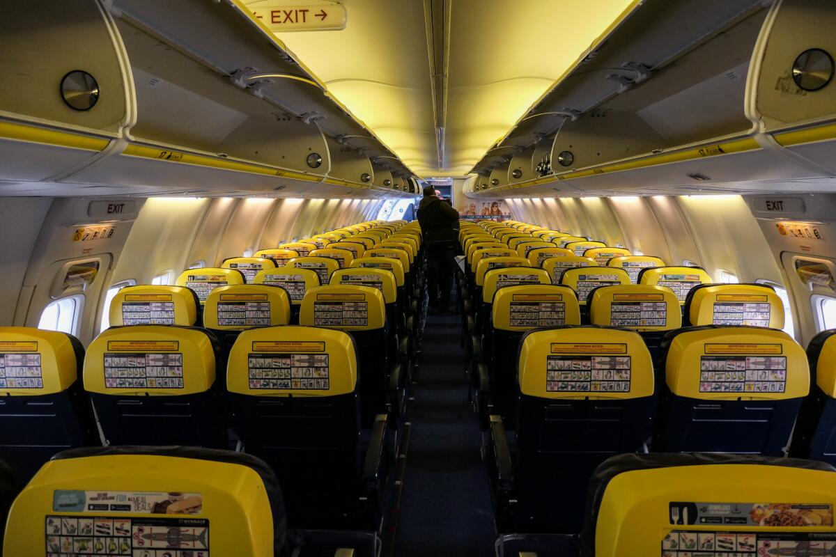 Seats and aisle in a single-aisle airplane. 