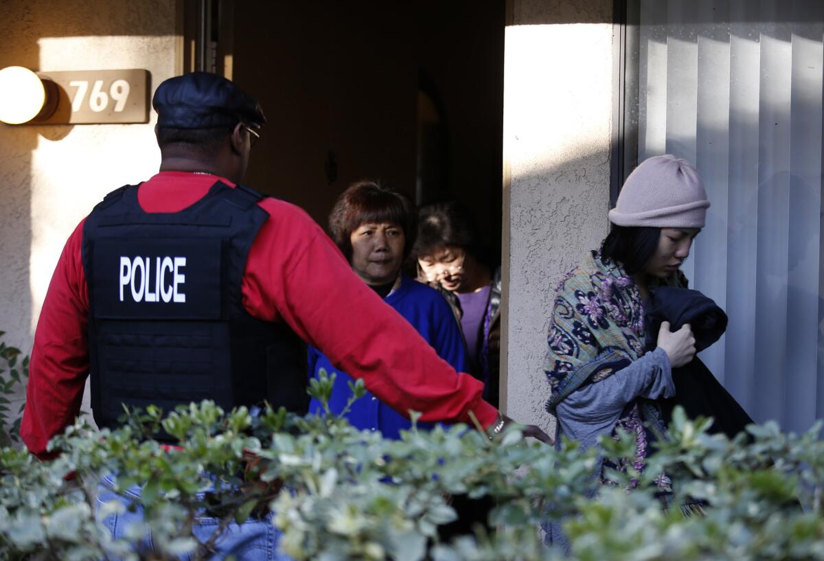 Federal agents serve warrants and question several residents at an apartment complex in Rowland Heights as part of an investigation into Southland-based "maternity tourism" schemes.