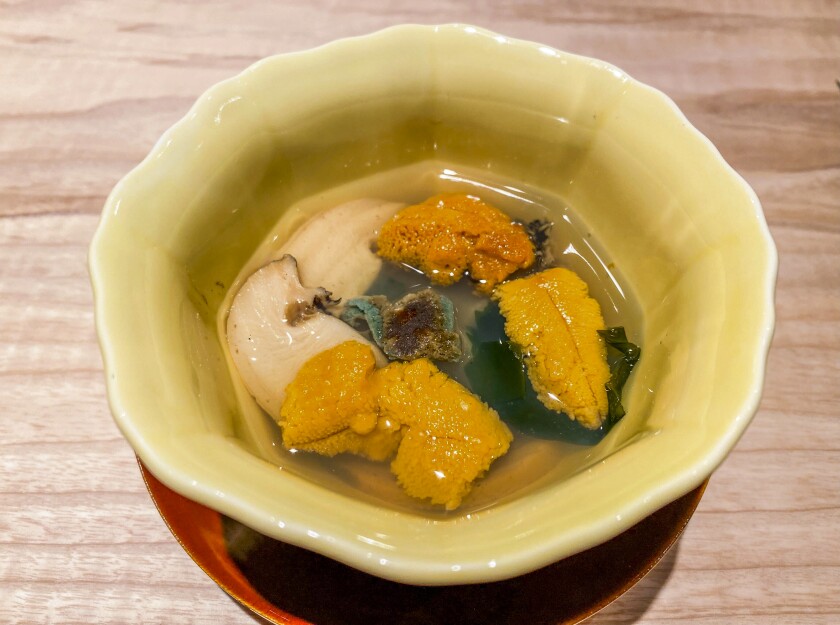 Seafood soup in a small bowl.