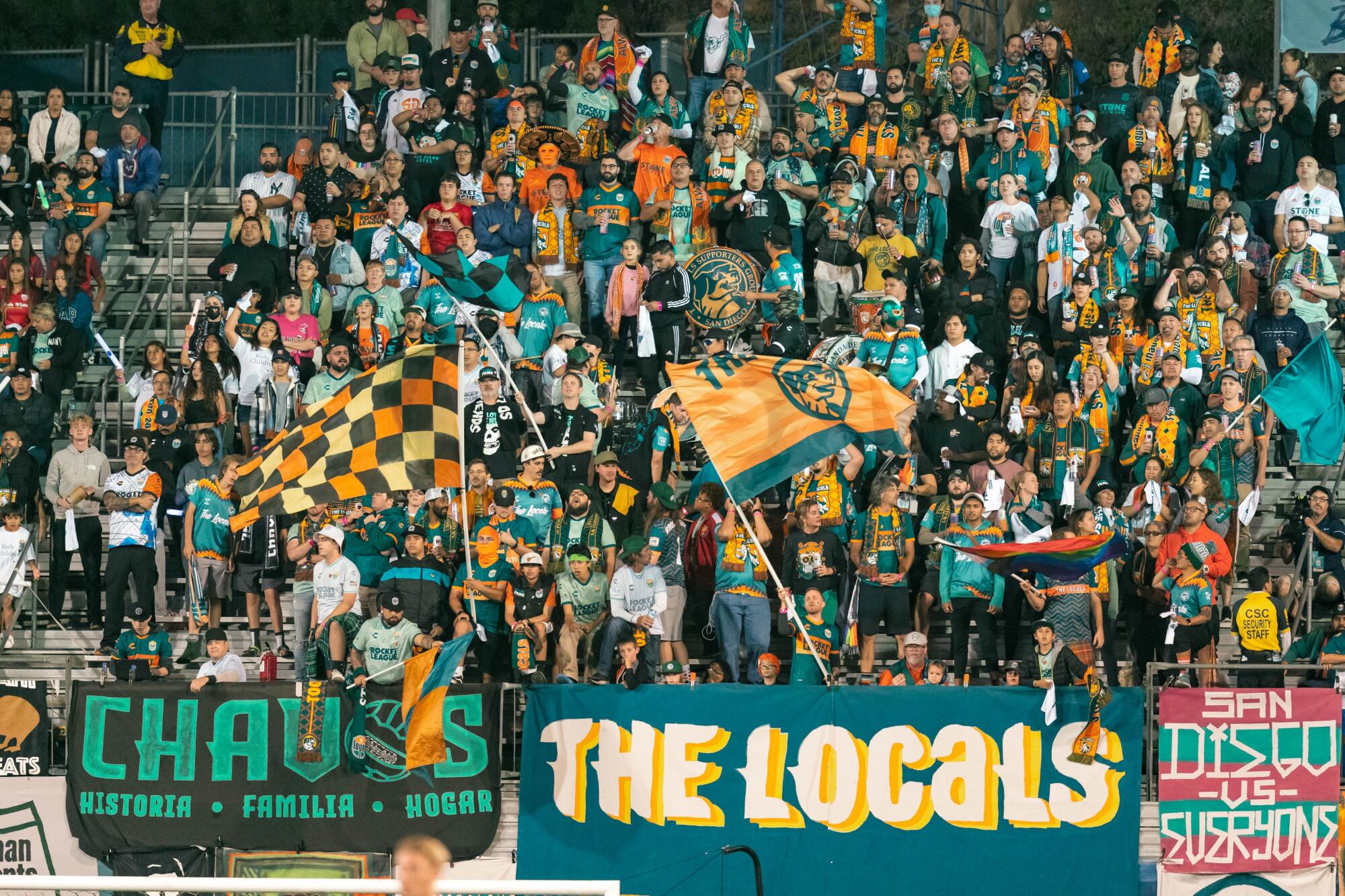 The Locals, an independent San Diego Loyal support group, cheers for the football team at a game.