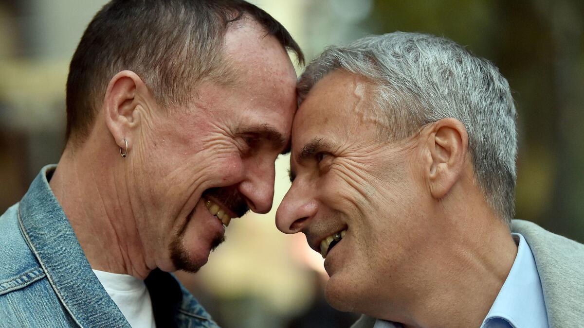 Karl Kreile, left, and Bodo Mende in Berlin on Sept. 27, 2017. Almost 40 years after their first kiss, Karl and Bodo are getting hitched.
