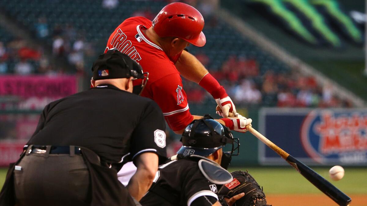 Angels center fielder Mike Trout connects for a run-scoring double against the White Sox in the first inning Thursday night in Anaheim.