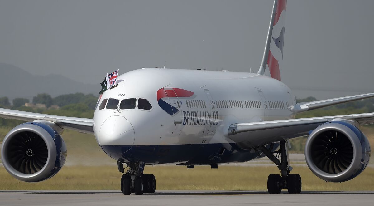 British Airways operates up to 850 flights a day. A British Airways plane is shown. 