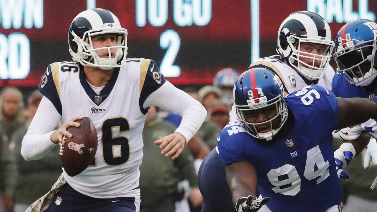 Rams quarterback Jared Goff throws a touchdown pass to Tyler Higbee during a game against the New York Giants on Nov. 5.
