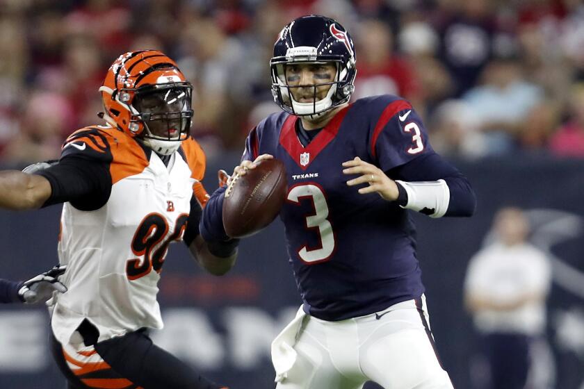 Texans quarterback Tom Savage (3) steps up in the pocket to avoid the rush of Bengals defensive lineman Carlos Dunlap during the third quarter Saturday.