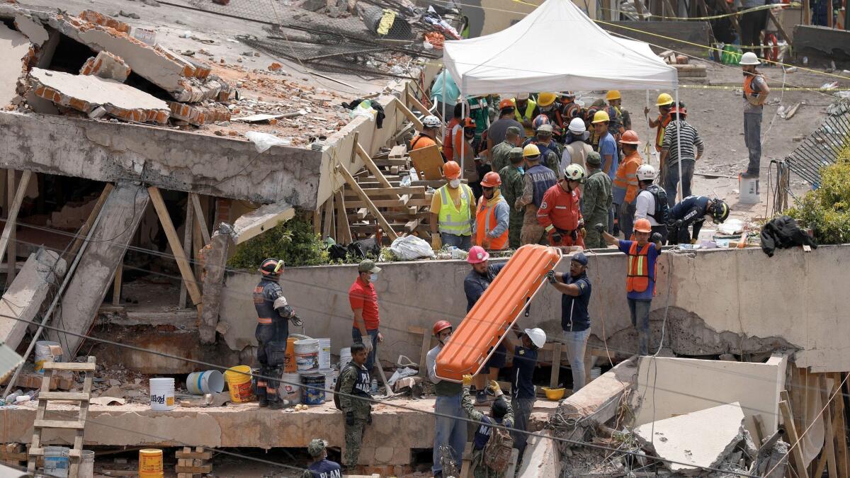 Rescue teams search for students trapped in the rubble at Enrique Rebsamen School in Mexico City.