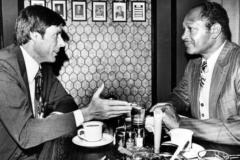Jan. 9, 1974: Sen. John Tunney and Mayor Tom Bradley discuss energy crisis over breakfast at downtown restaurant.
