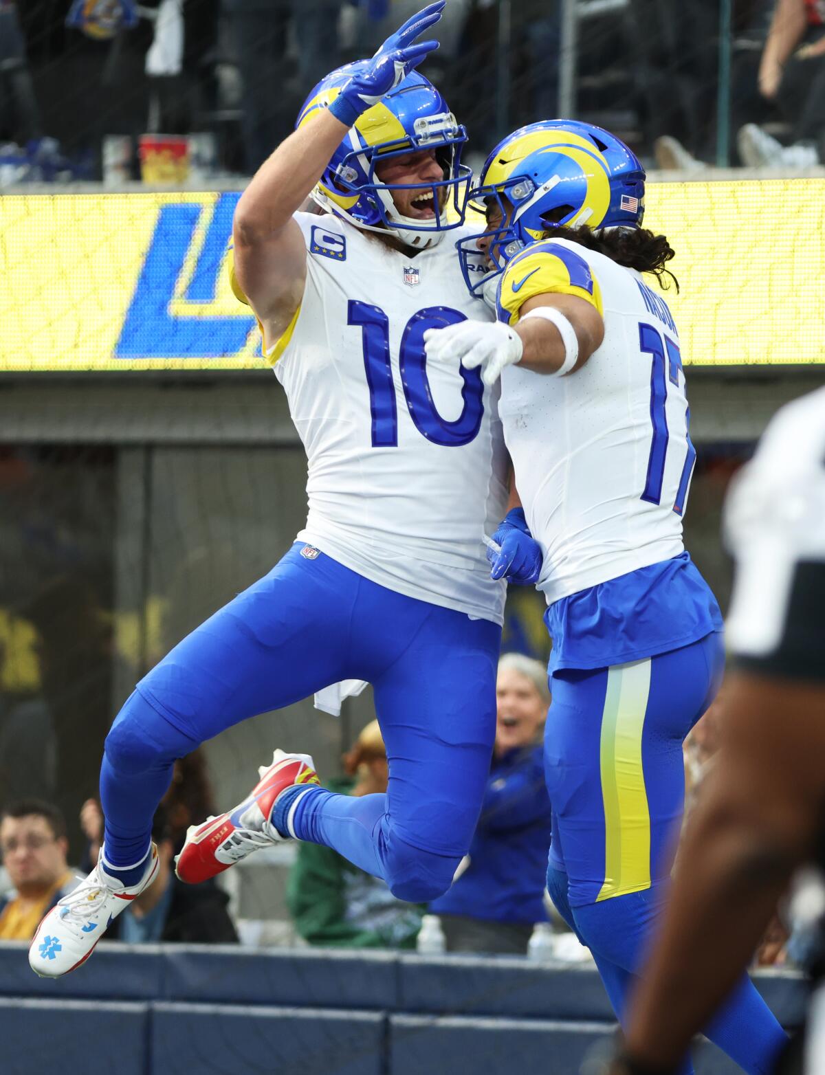 The Rams' Cooper Kupp (10) celebrates a Puka Nacua touchdown reception against the Cleveland Browns.
