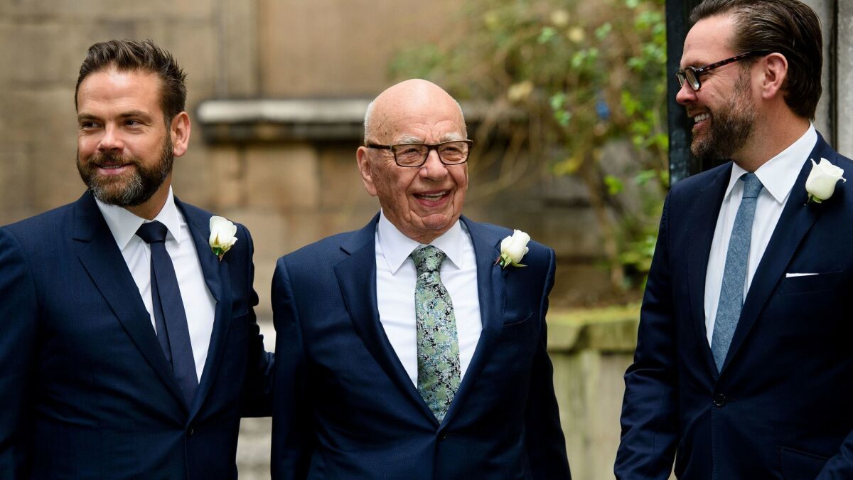 Rupert Murdoch is flanked by sons Lachlan, left, and James in 2016.