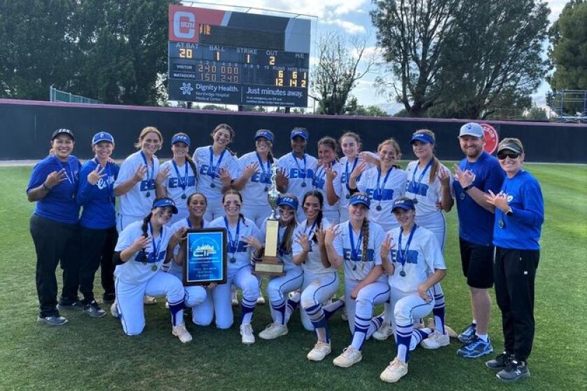 The El Camino Real softball team poses for a photo after winning the City Section Open Division title Saturday.