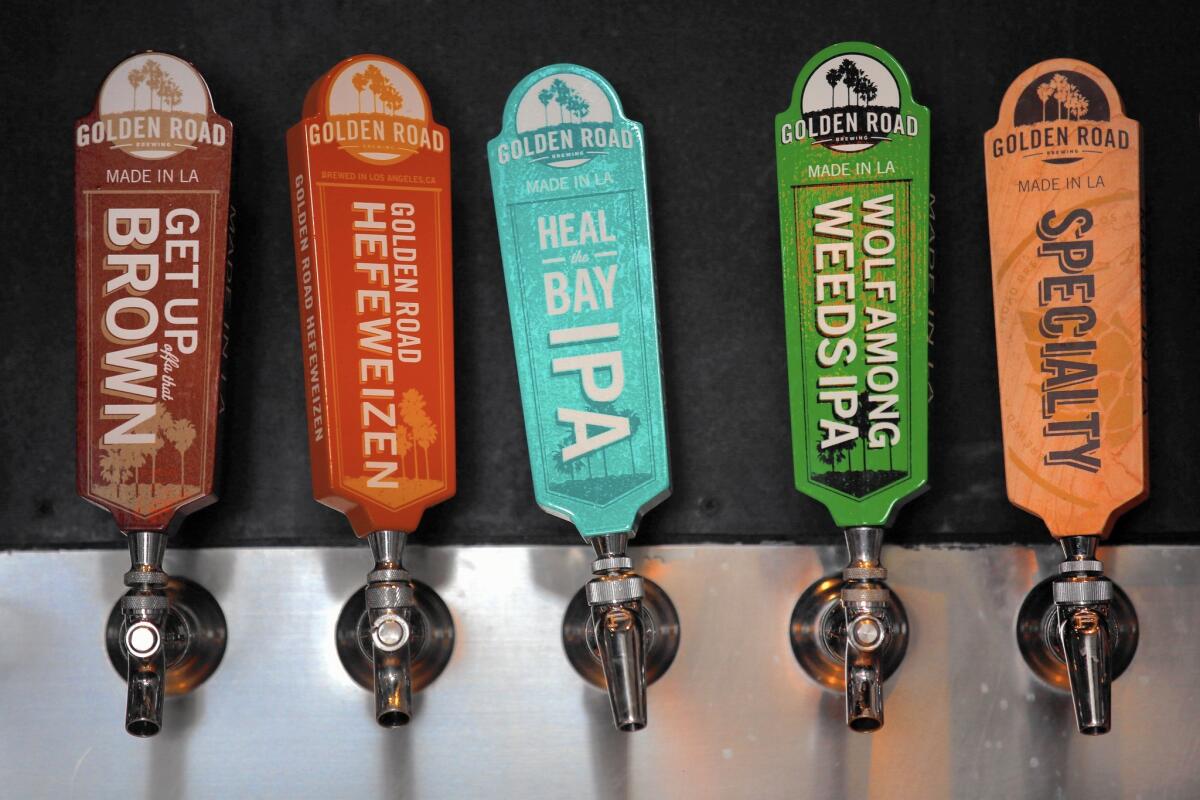 Beer taps at L.A.’s largest craft brewer, Golden Road Brewing, which was recently acquired by Anheuser-Busch.