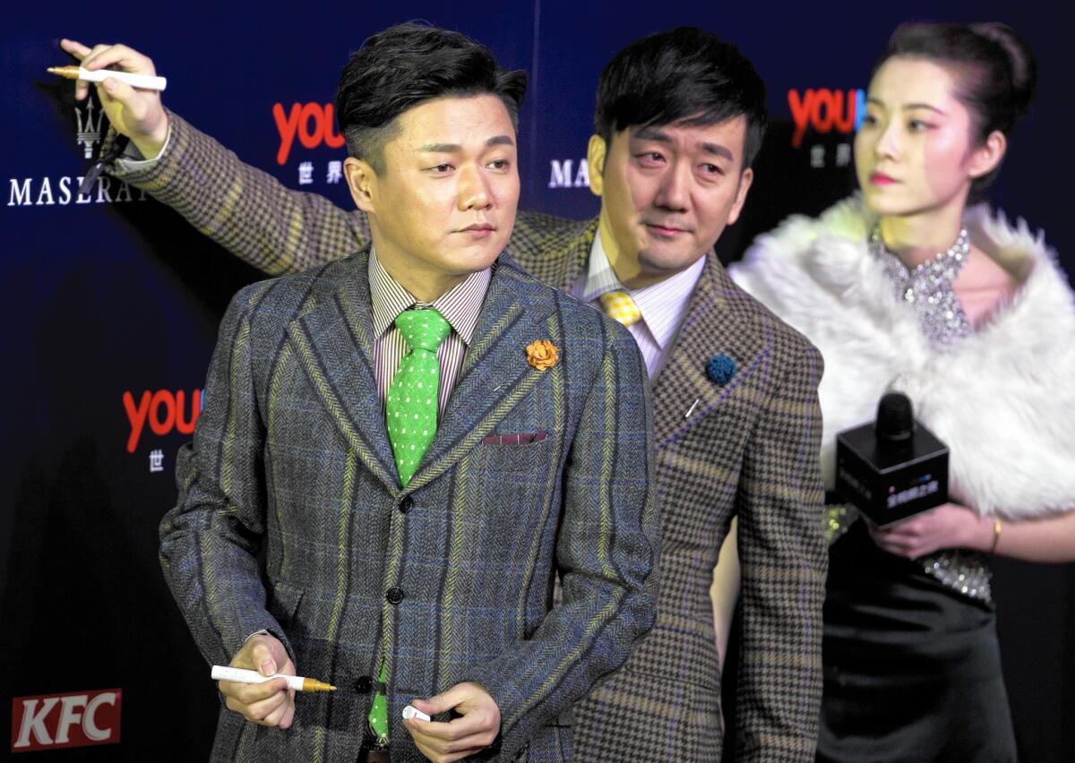 Chopstick Brothers Xiao Yang, left, and Wang Taili created the song "Little Apple" for the film “Old Boys: The Way of the Dragon,” but the song’s video has surpassed the film in popularity.
