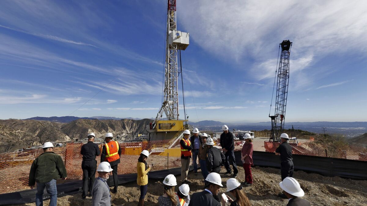 Officials tour the drill site of a relief well to stem the methane leak at the Aliso Canyon gas storage facility in 2015.