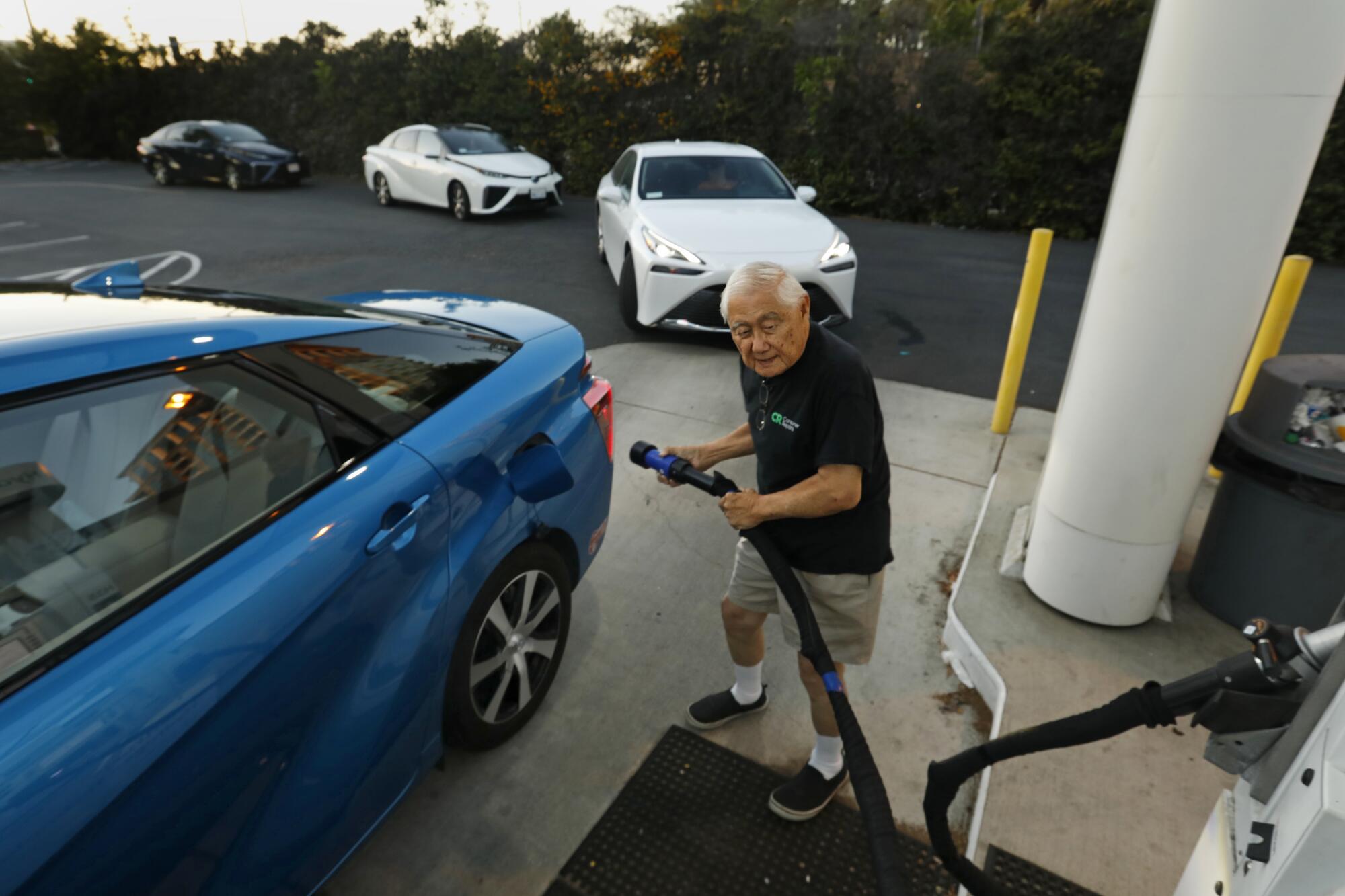 A man fills up his hydrogen-fueled Mirai at a station in Irvine