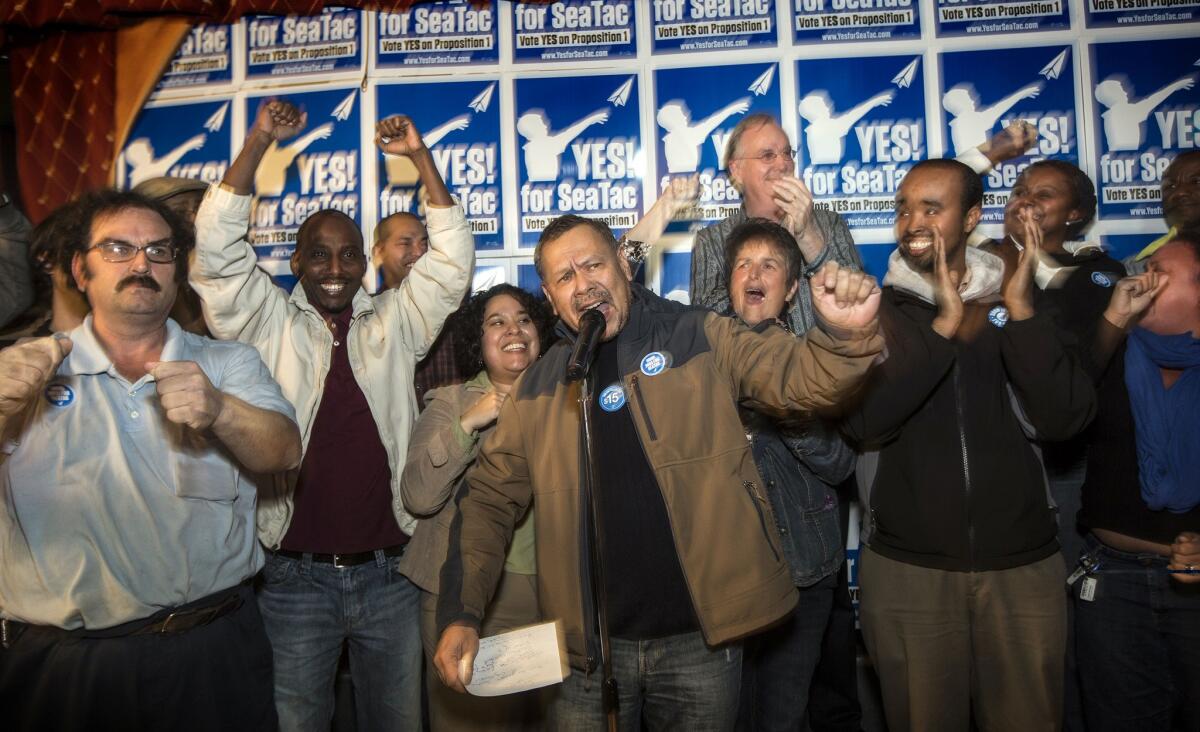 Sergio Salinas, president of SEIU Local 6 speaks to a crowd at Bull Pen Pub in SeaTac.