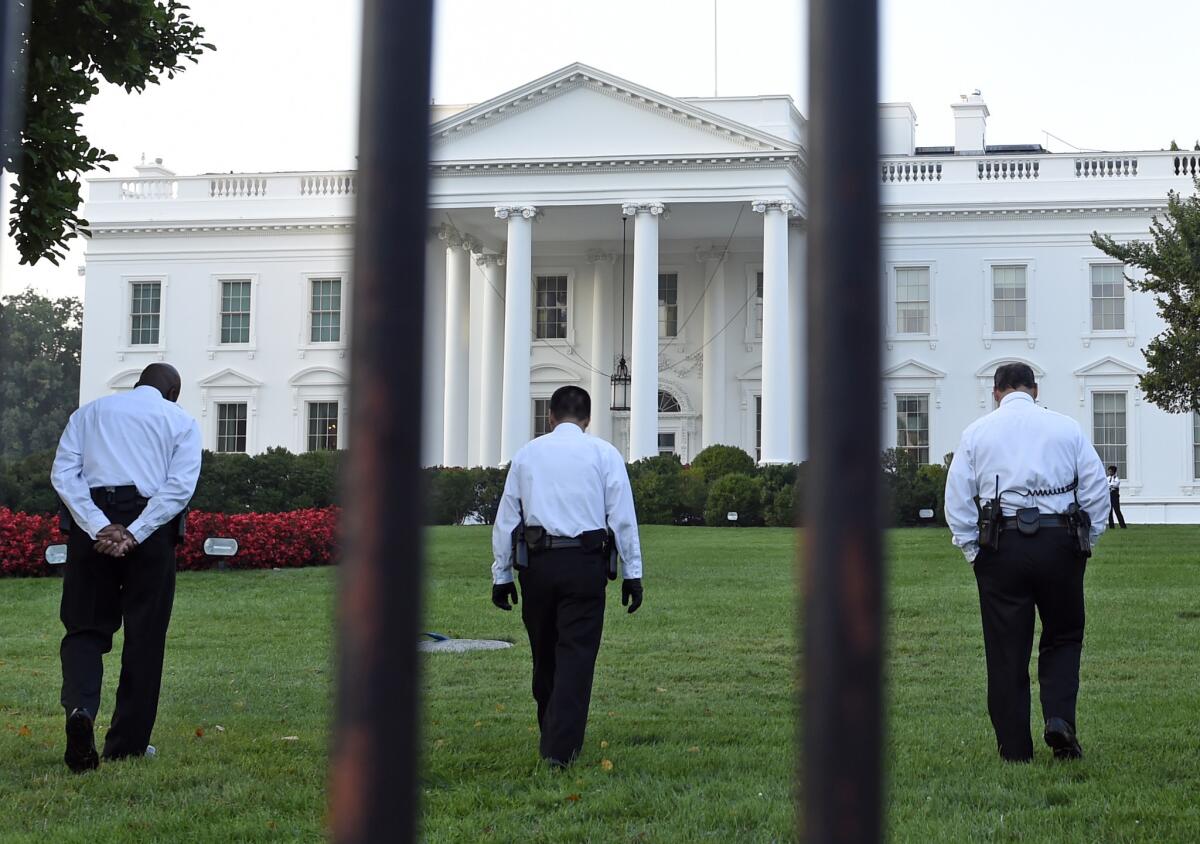 Secret Service officers on the White House lawn Saturday.