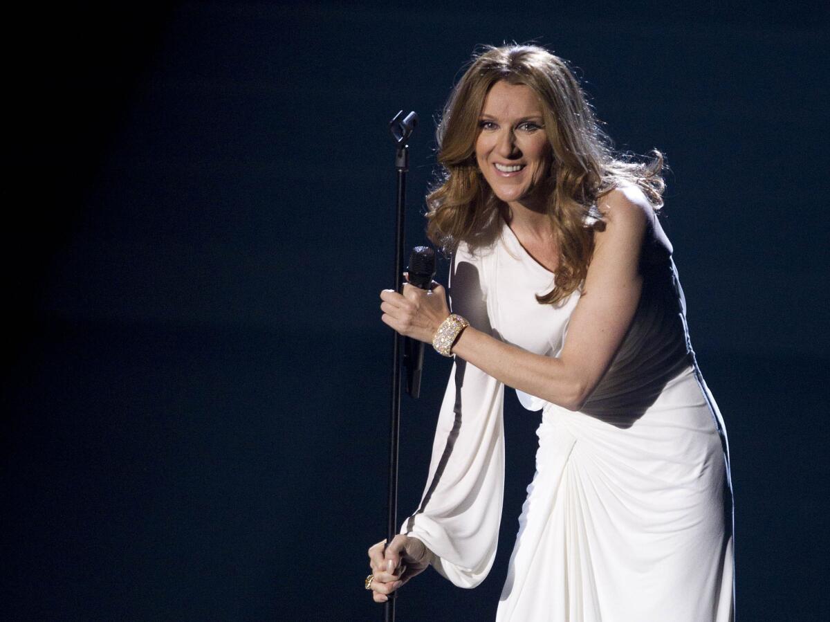 Celine Dion, shown onstage during her opening-night performance at Caesars Palace in Las Vegas in 2011, will return to performances there in August after a year's absence.