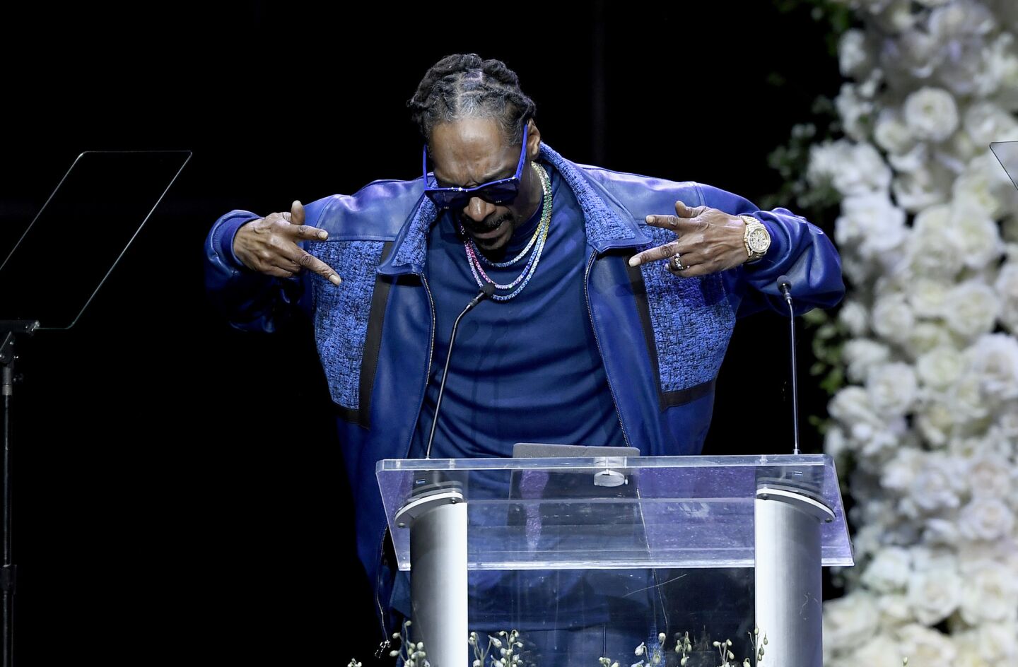 Snoop Dogg speaks at the memorial.