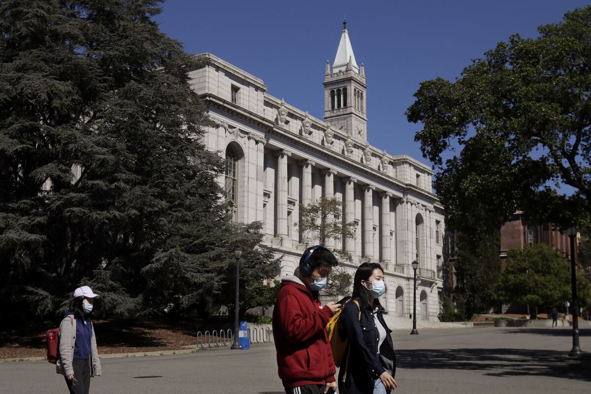 Students walking past Wheeler Hall at UC Berkeley in March 2020.