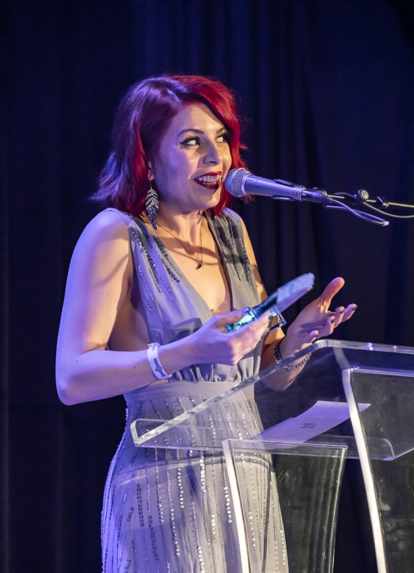 Whitney Shay accepts an award at the 2018 San Diego Music Awards at House of Blues.