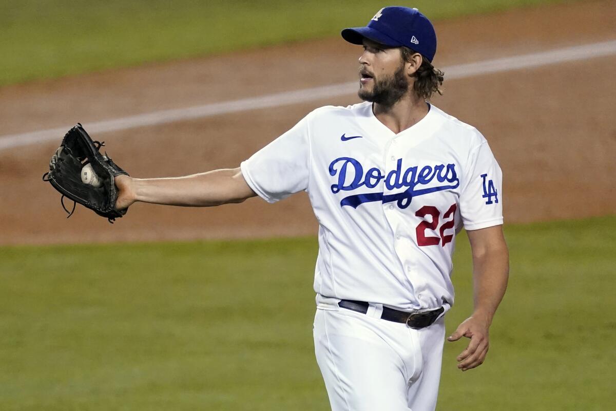 Dodgers pitcher Clayton Kershaw catches a ball.