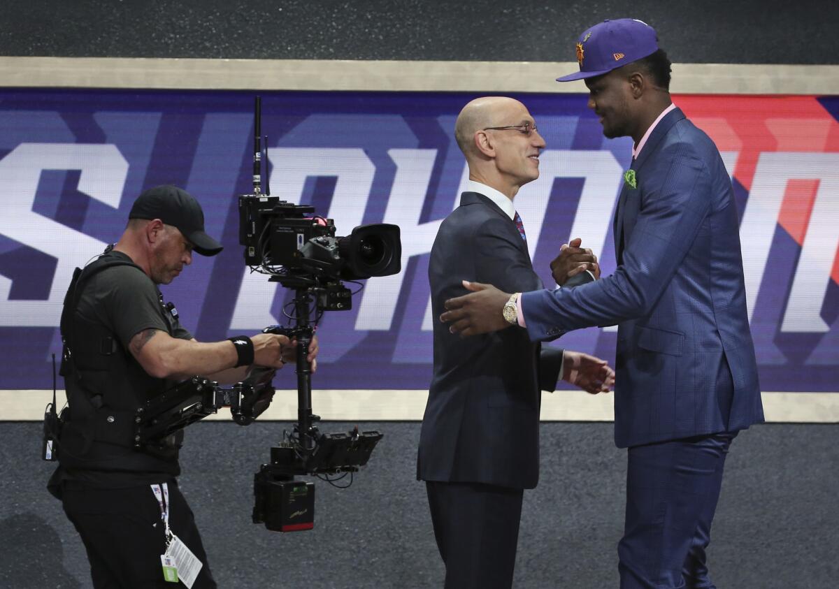 Deandre Ayton is greeted by Commissioner Adam Silver after he was picked first overall by the Phoenix Suns in the 2018 NBA draft.