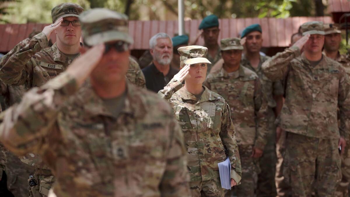 U.S. soldiers salute during a change of command ceremony at Resolute Support headquarters in Kabul, Afghanistan on July 15.