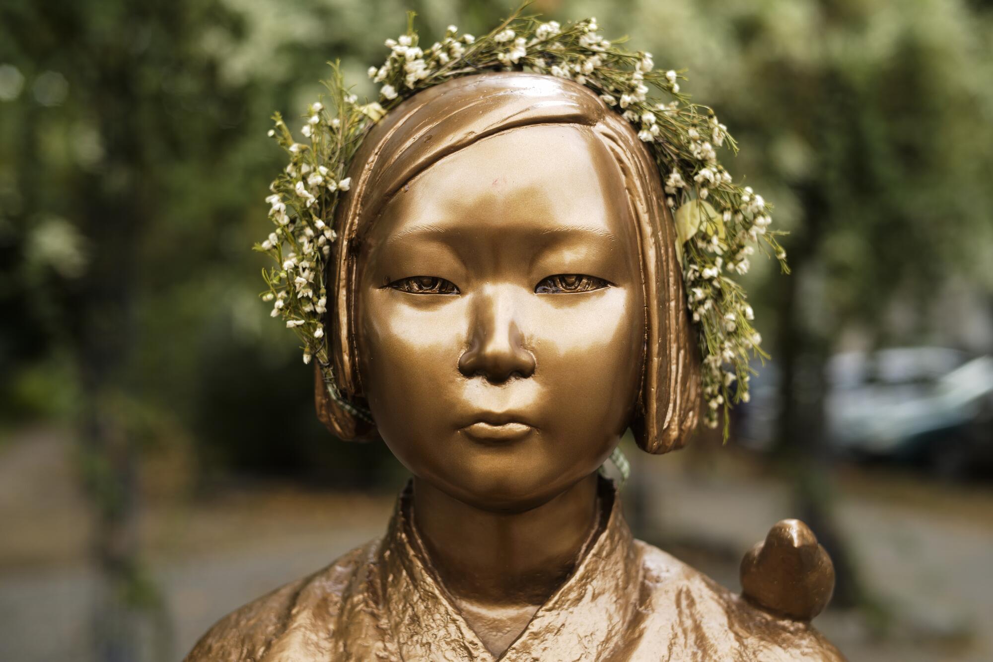 A close-up of the face of a "comfort woman" statue