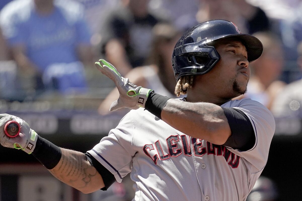 Cleveland Guardians' Jose Ramirez watches his two-run home run during the second inning of a baseball game against the Kansas City Royals Saturday, July 9, 2022, in Kansas City, Mo. (AP Photo/Charlie Riedel)