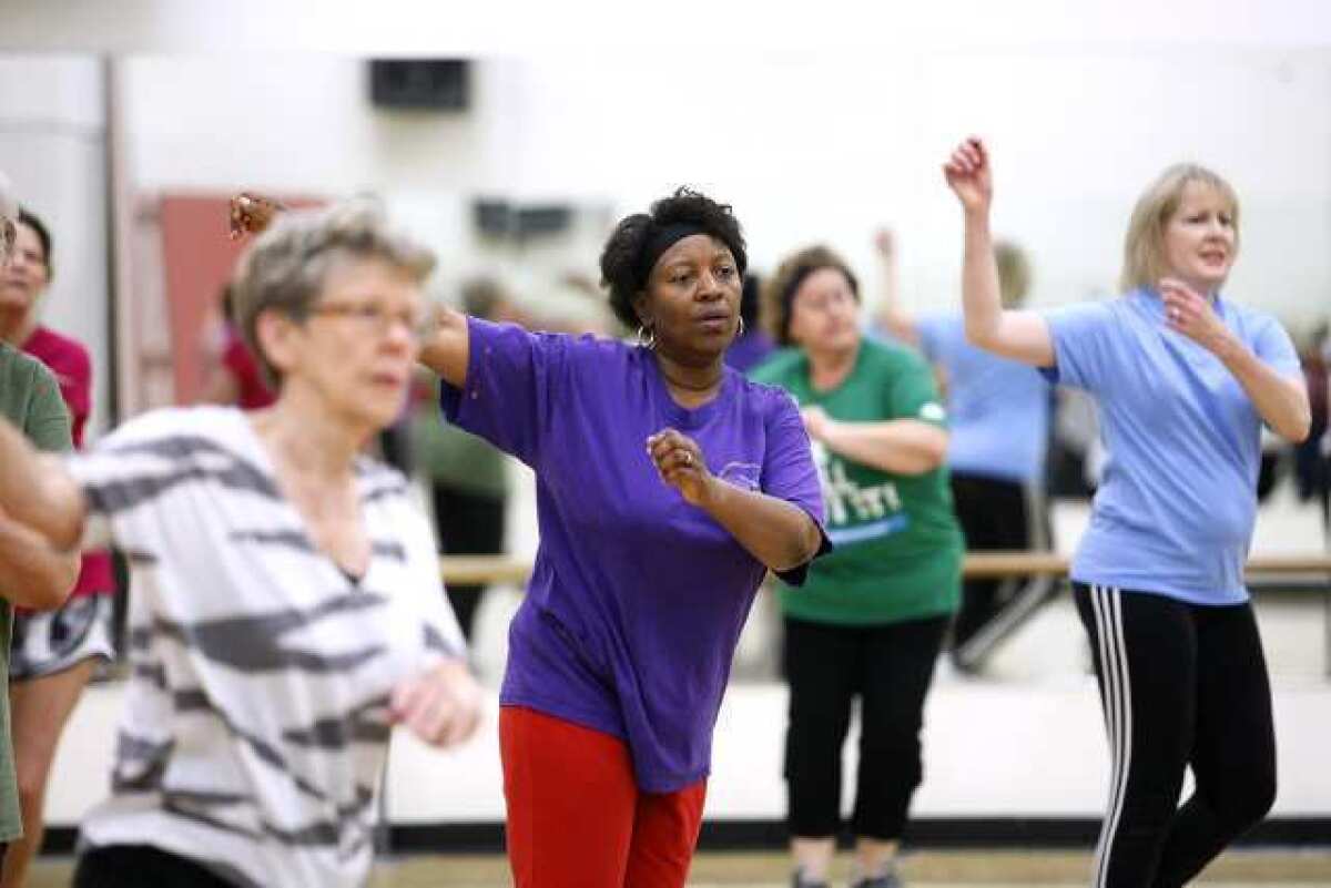 Cynthia Roye of La CaÃƒÆ’Ã‚Â±ada, center, gets moving in the "50 Moving Forward" low impact class at the Crescenta-CaÃƒÆ’Ã‚Â±ada Family YMCA in La CaÃƒÆ’Ã‚Â±ada Flintridge on Tuesday, April 2, 2013. The class is geared for adults 50 and older and they do not have to be members of the Y.