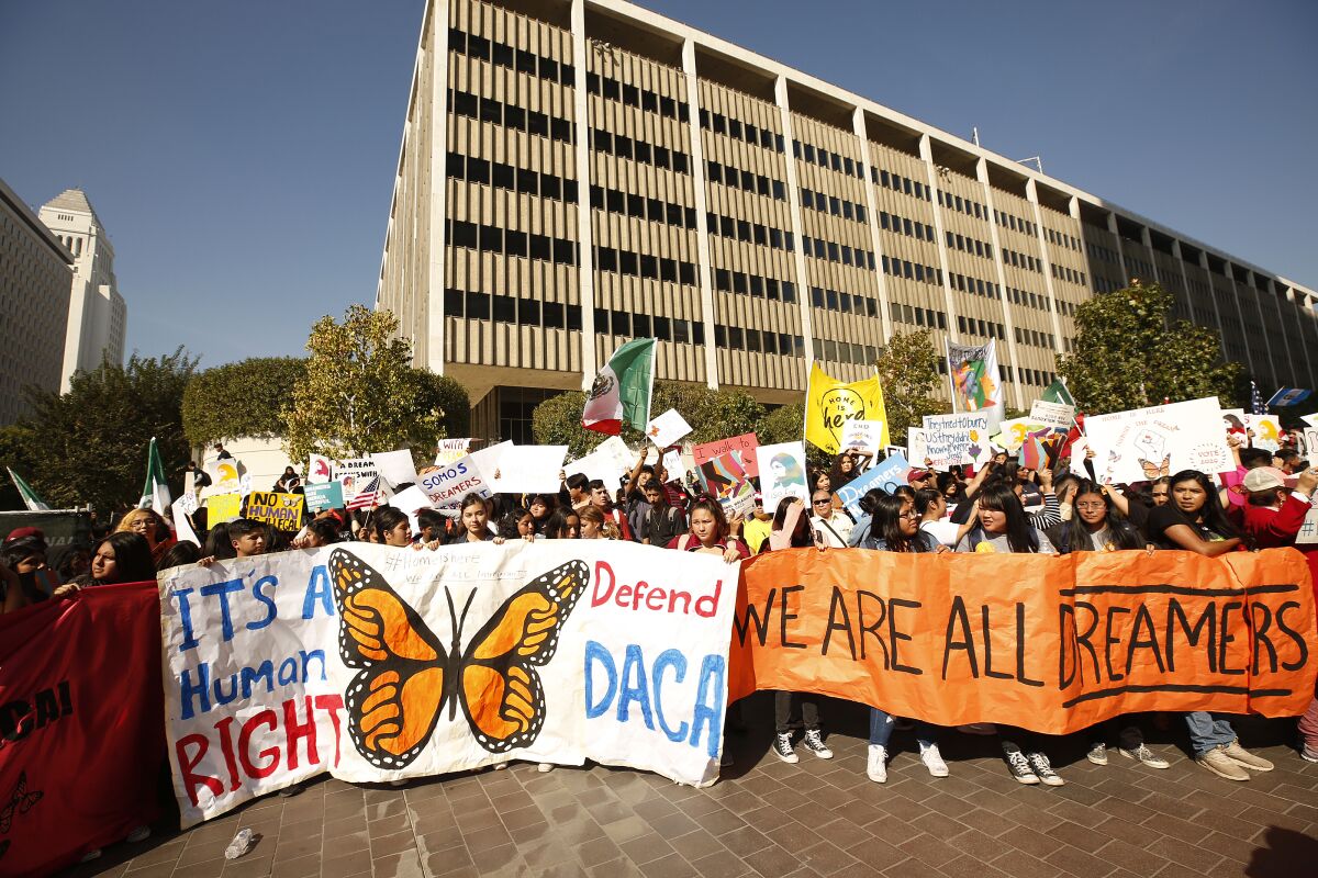 A large crowd rallies in downtown Los Angeles in support of the DACA program