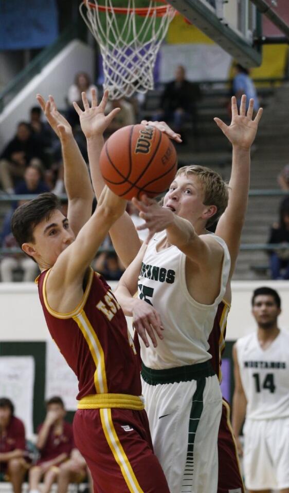 Estancia's Kyle FitzGerald, left, and Costa Mesa's George Williamson battle for the ball.
