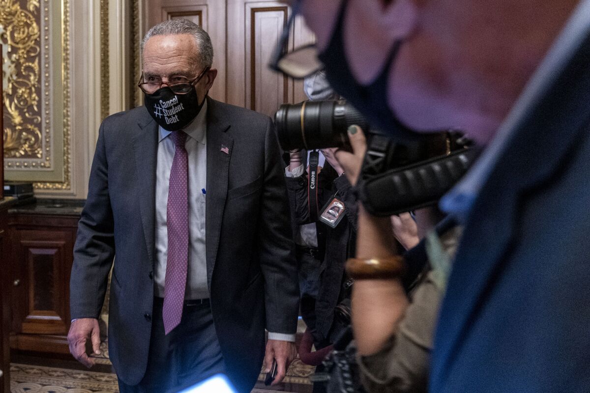 Senate Majority Leader Sen. Chuck Schumer of N.Y., leaves a Senate Democratic meeting at the Capitol in Washington, Wednesday, Oct. 6, 2021, as a showdown looms with Republicans over raising the debt limit. (AP Photo/Andrew Harnik)