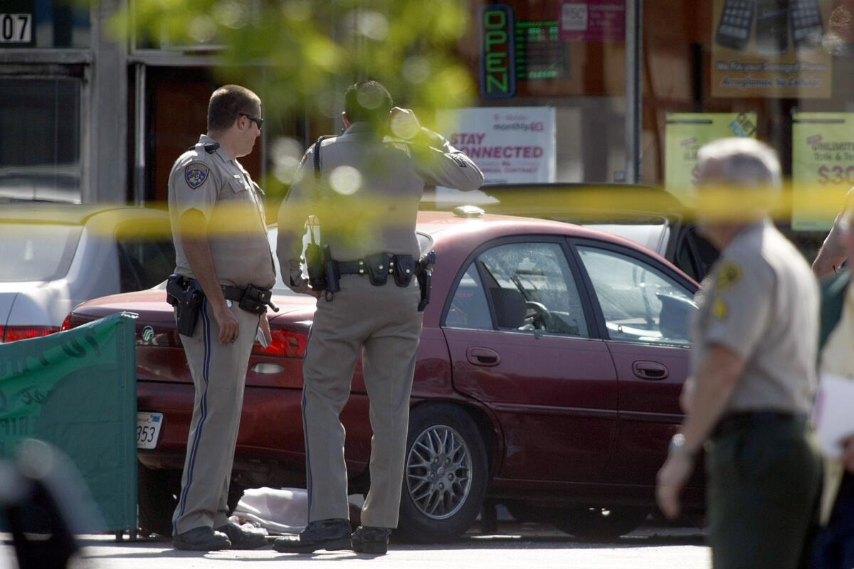 Los Angeles County sheriff's deputies fatally shot a motorist in an Athens area strip mall Friday afternoon after his vehicle allegedly struck an officer.