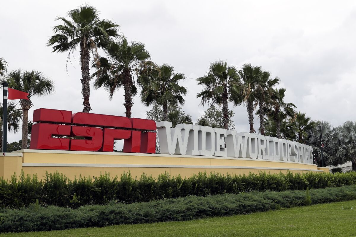 A sign marking the entrance to ESPN's Wide World of Sports at Walt Disney World is seen in Kissimmee, Fla.