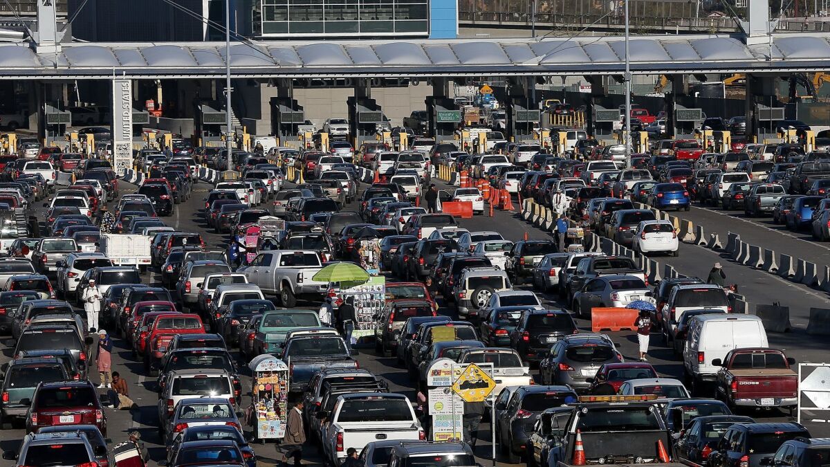 Cars wait in line to enter the United States at the San Ysidro Port of Entry on January 27, 2017 in Tijuana, Mexico.