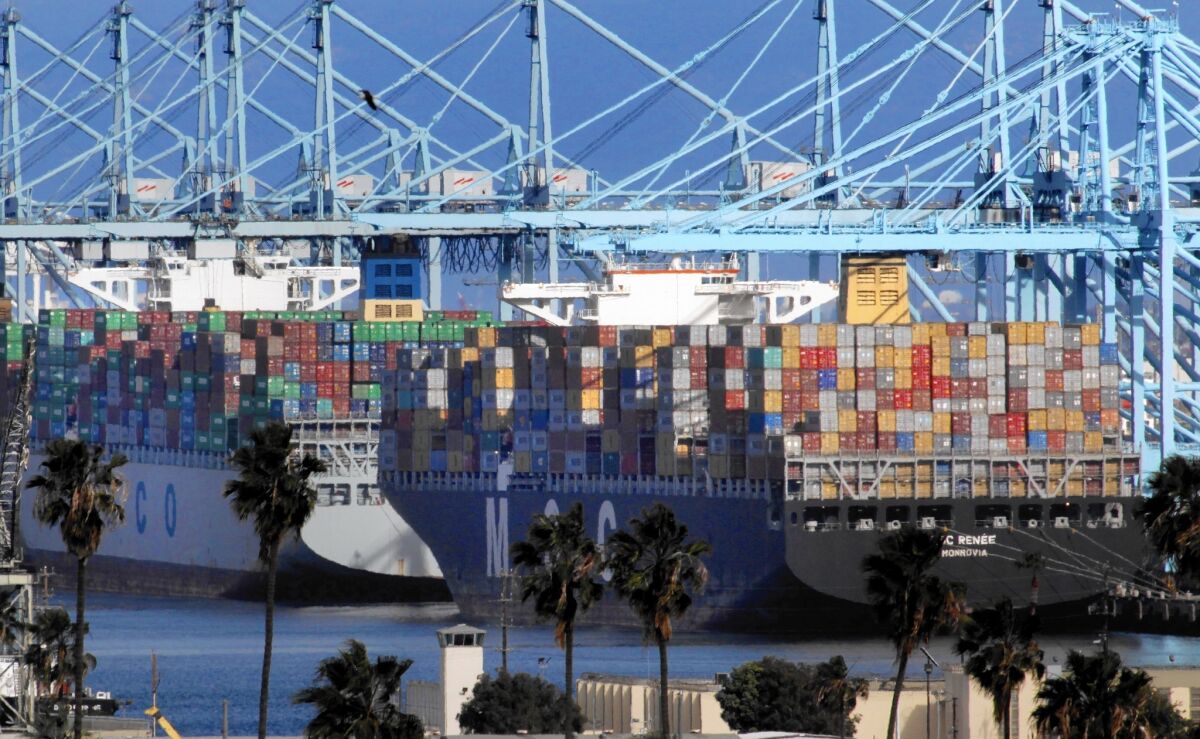 Many California firms suffered from missed orders and produce spoiling on docks because of a labor dispute at West Coast ports. Above, the Port of L.A.