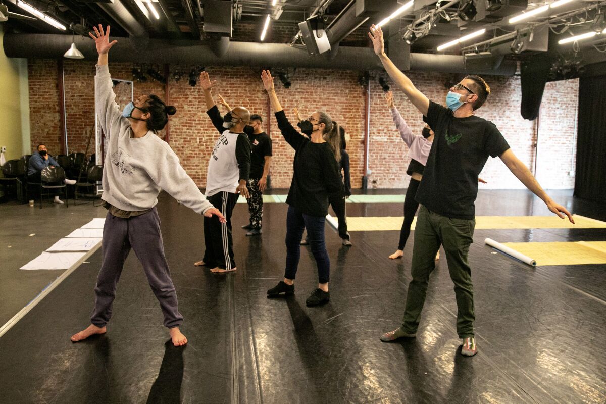 Suchi Branfman rehearses with a group of dancers.