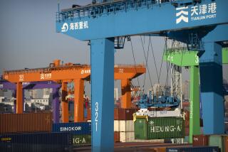 File - A crane lifts a shipping container at an automated container port in Tianjin, China, Jan. 16, 2023. The global economy, which has proved surprisingly resilient this year, is expected to falter next year under the strain of wars, still-elevated inflation and continued high interest rates. (AP Photo/Mark Schiefelbein, File)
