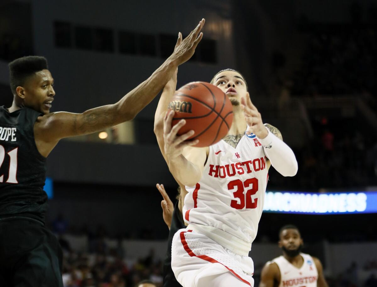 Houston's Rob Gray scores the game-winning basket against San Diego State.