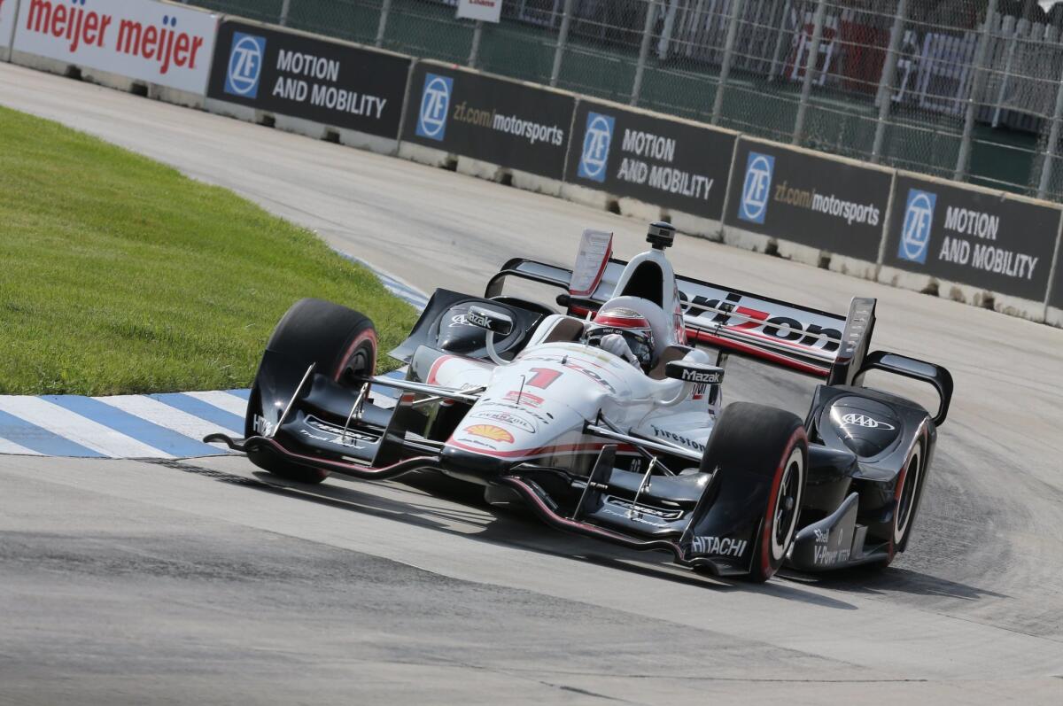 IndyCar driver Will Power guides his car through the first turn during qualifying Friday for the first race of the Detroit Grand Prix doubleheader.