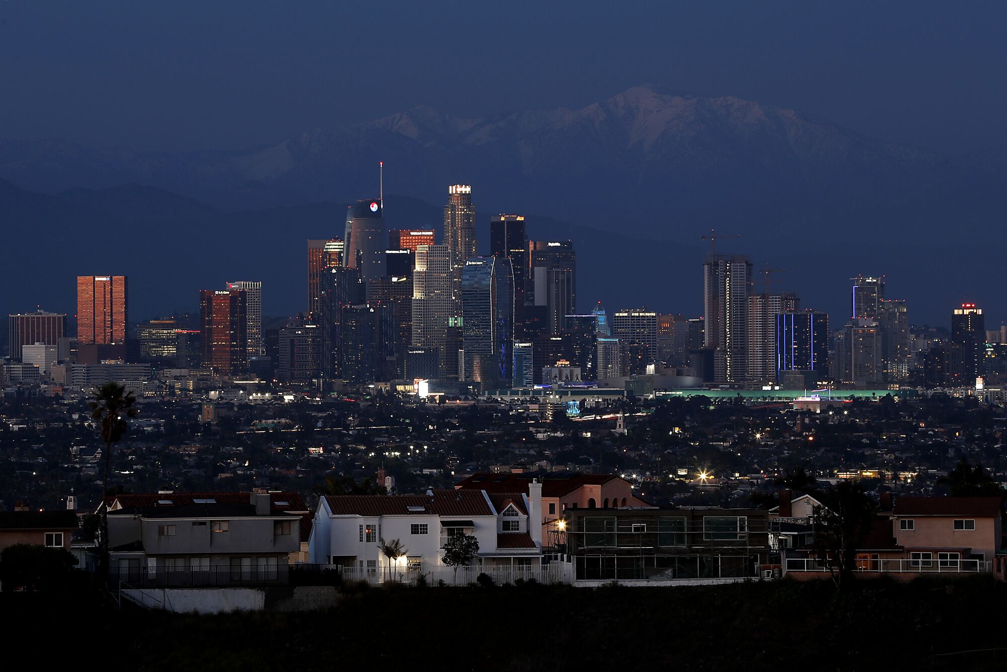 Dusk settles on downtown Los Angeles and the snow-capped Mt. Baldy. 