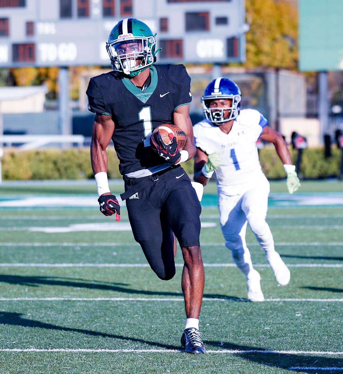 Dijon Stanley of Granada Hills takes off on a 90-yard touchdown run in first half against Palisades. 