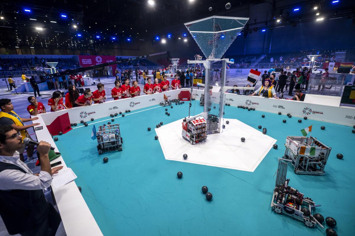 Robots from different teams compete during the 6th edition of the First Global Robotics Challenge in Geneva, Switzerland, Saturday, Oct. 15, 2022. (Martial Trezzini/Keystone via AP)
