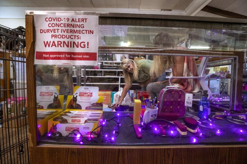 ROLLING HILLS, CA - SEPTEMBER 13, 2021: Tracey Savich, owner of Rolling Hills General Store, is photographed inside her store. Inside display case is ivermectin, an anti-parasitic drug, commonly used to deworm horses, cows and other livestock that has been controversially touted as a preventative and treatment for COVID-19, particularly among those who remain skeptical about the vaccine. While its efficacy against COVID-19 has been debunked, some Californians have managed to acquire prescriptions from their healthcare providers. (Mel Melcon / Los Angeles Times)