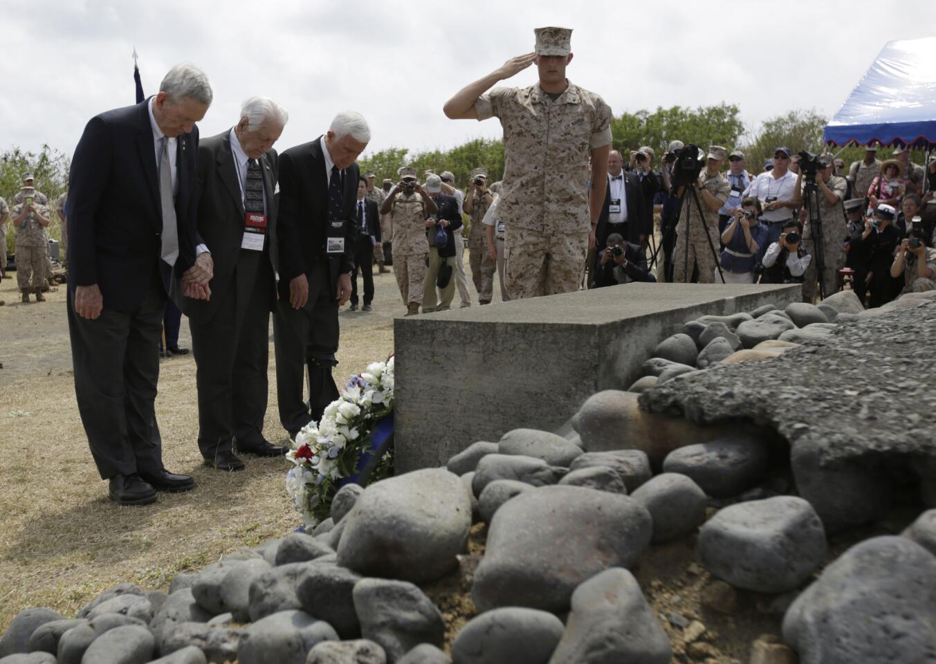 U.S. veterans pay respect at the Iwo Jima battle monument during a ceremony marking the 70th anniversary of the battle.