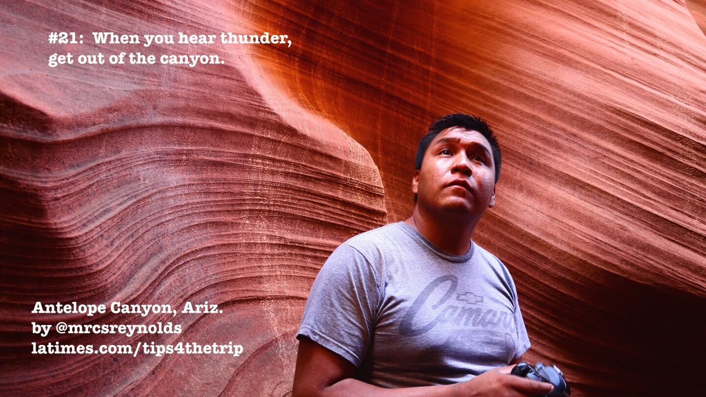 Guide Raymond Chee stands at Upper Antelope Canyon, Ariz., on a cloudy day. Photo taken in 2013.